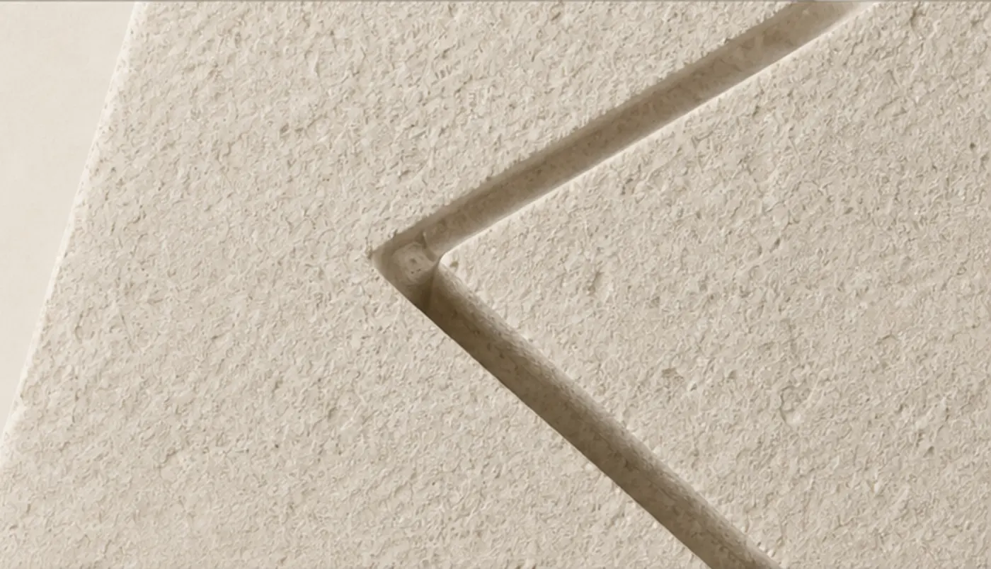 A shallow angled cut carved into limestone